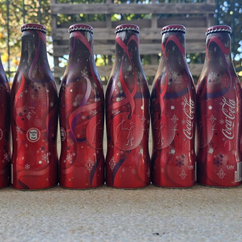 Coca Cola bottles new, festive set of 9 aluminum 250ml