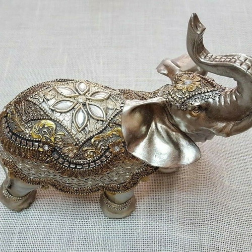 Handmade wooden elephant used with decorations and crystals