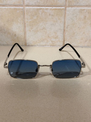 Rectangular sunglasses with silver metal frame and blue gradient lenses