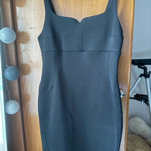 Pink Woman dress black like new, tight with nice chest cut