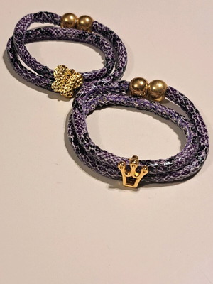 Bracelets with purple shiny cord and gold metallic elements like new, set of 2