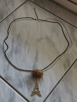 Necklace with Eiffel Tower and decorative fur pompom like new, black and gold