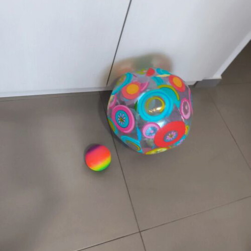 Inflatable beach ball and small plastic ball