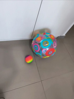 Inflatable beach ball and small plastic ball