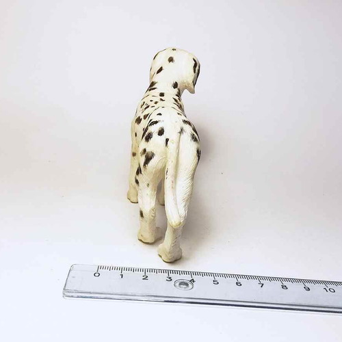Plastic dog figure used with marks and scratches