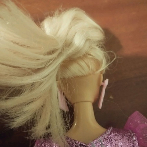 Doll with pink earrings and articulated joints used