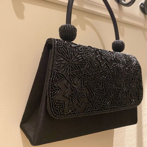 Mini black handbag like new with beaded embossed design