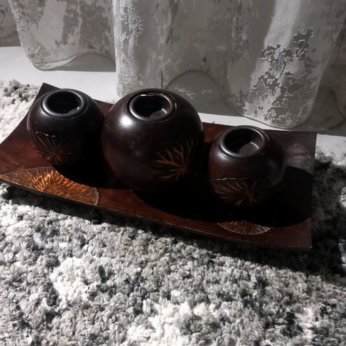 Plate with three wooden candlesticks used