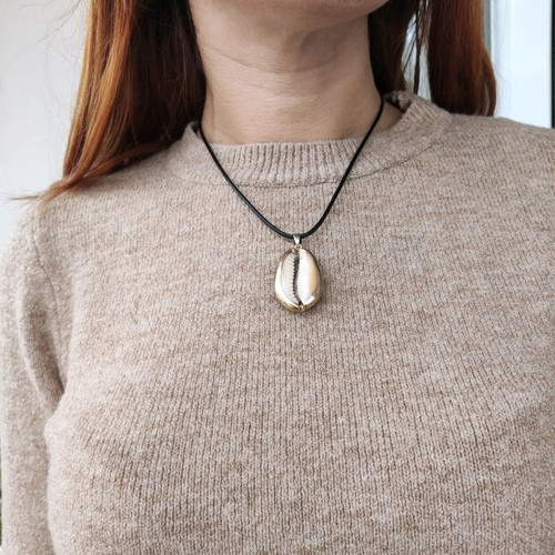 Necklace new with black cord and gold-plated shell