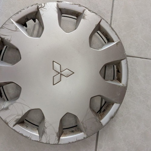 Mitsubishi Colt wheel cover, slightly damaged