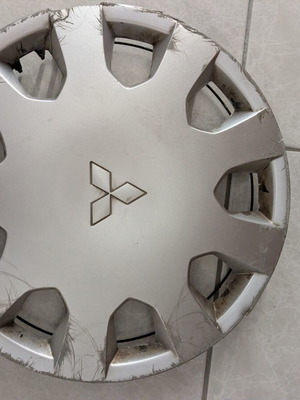 Mitsubishi Colt wheel cover, slightly damaged