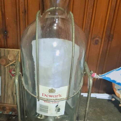 Dewar's White Label whisky used large 4.5L bottle with metal cradle vintage