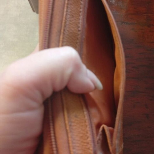 Wallet used camel color with many pockets and minor defect