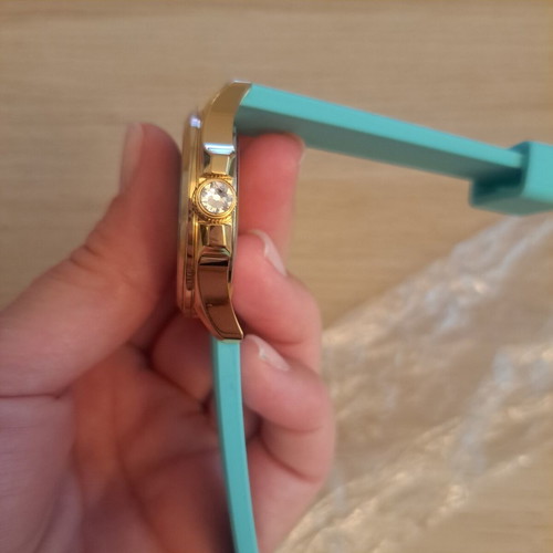 Juicy Couture watch new, gold stainless steel with turquoise silicone strap