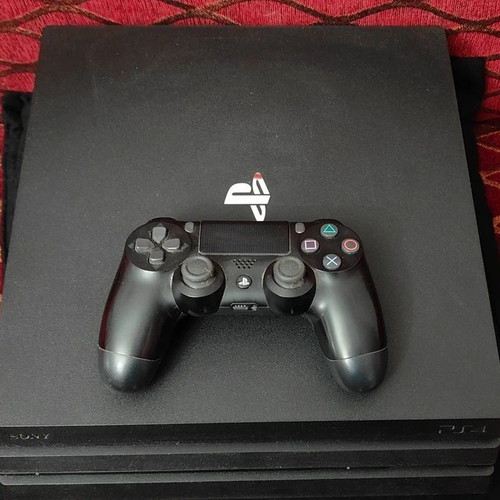 PlayStation 4 Pro 1TB like new with controller and 2 games