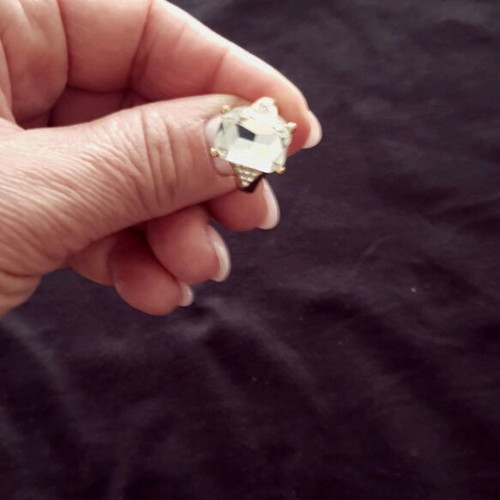 Ring made of gold steel with transparent white stone like new