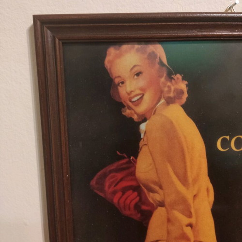 Coca Cola advertisement in wooden frame used