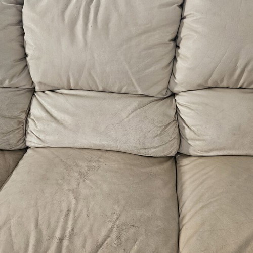 Leather three-seater sofa used, beige color