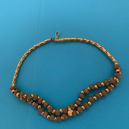 Necklace with khaki stone and gold used