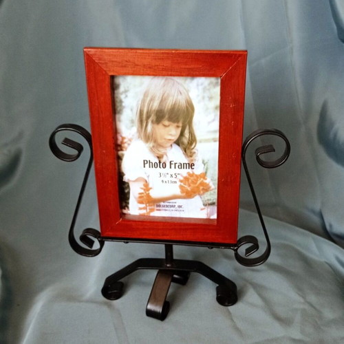 Rotating wooden photo frame with metal decorative base like new