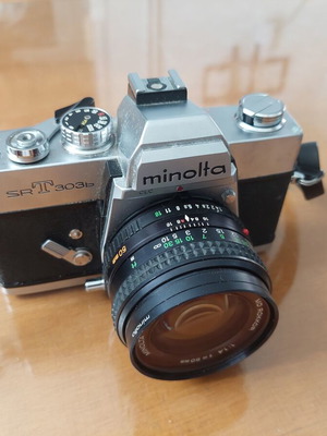 Minolta SR-T 303b camera set with MD Rokkor 50mm f/1.4 and Sigma Zoom lens