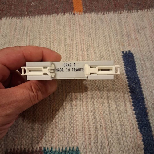 Legrand rail-mounted button switch with indicator light