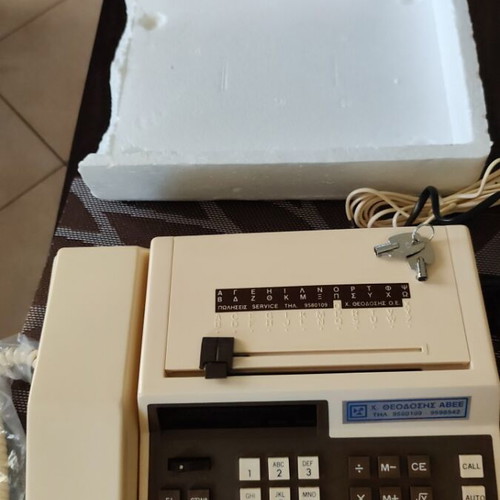 Vintage tabletop telephone with calculator and directory, new