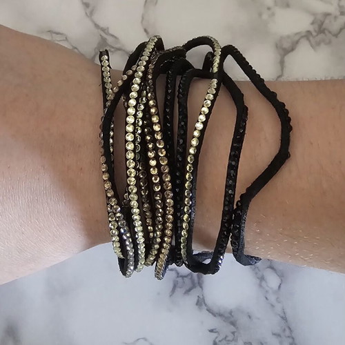 Black suede bracelet with black and beige stones