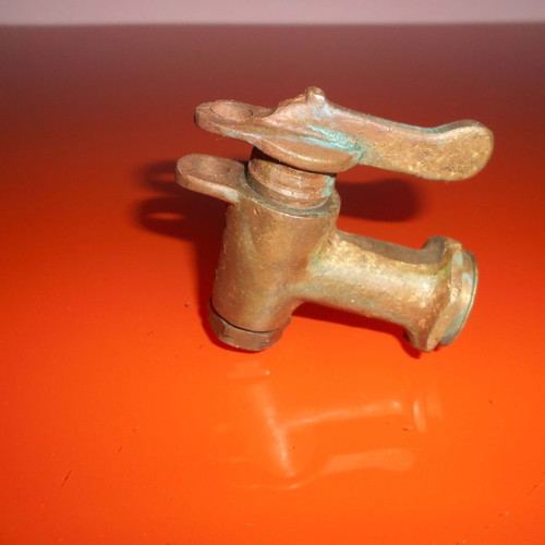 Old brass tap used with lock attachment option