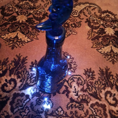Bottle with LED light like new, blue and red