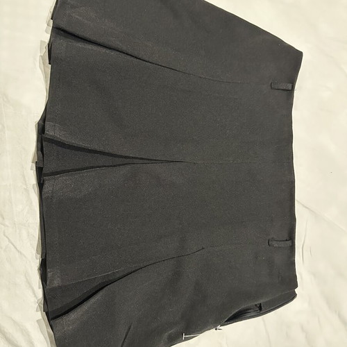 Black pleated mini skirt with hidden zipper