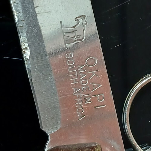 Okapi pocket knife used, carbon steel blade, wooden handle