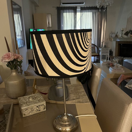 Modern table lamp with black and white geometric shade, optical art