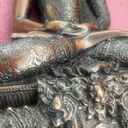 Thai Buddha statue with detailed embossed decoration