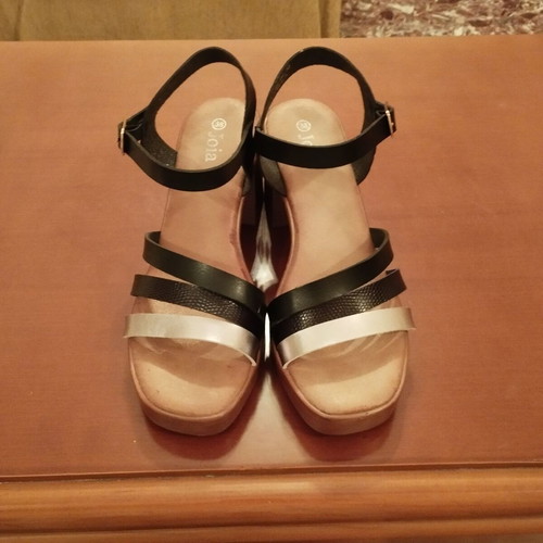 Sandal size 38 black and silver like new with strap and low heel