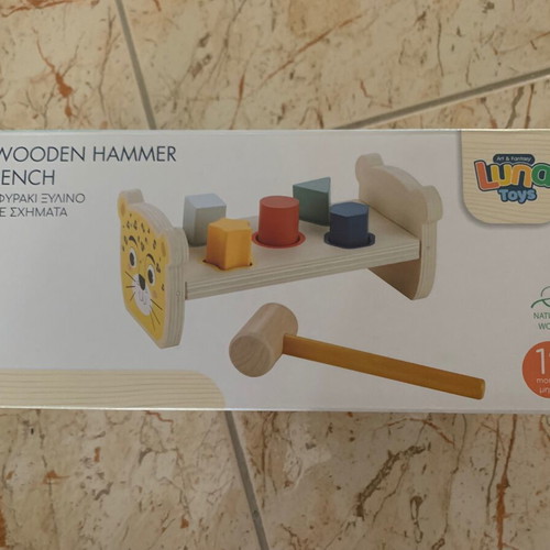 Wooden bench with colorful figures and hammer, like new