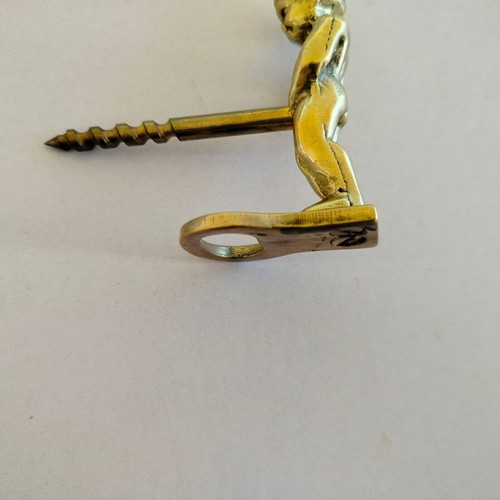 Brass corkscrew opener used with minor metal wear