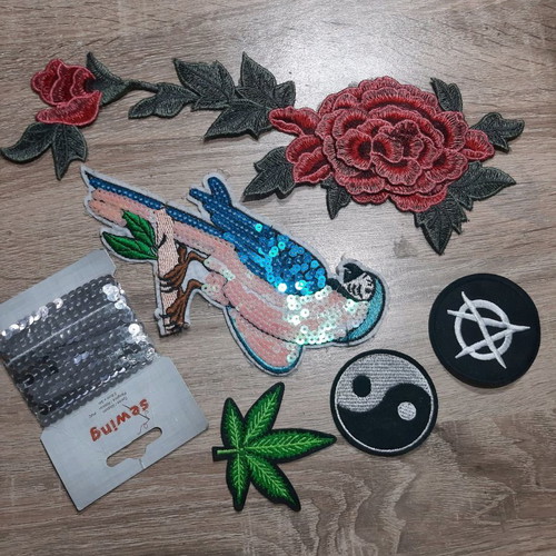 Iron-on patches for garments used with sequins and embroidery designs