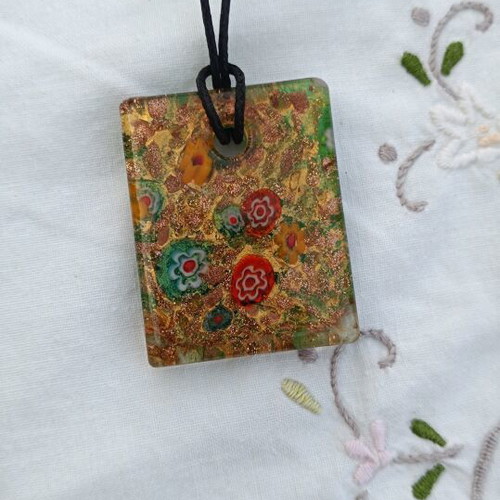 Murano pendant with millefiori floral design and aventurine base