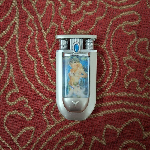 Vintage lighter with lenticular image like new, silver metal