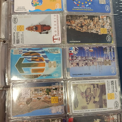 Phone card album with approximately 400 used Greek cards