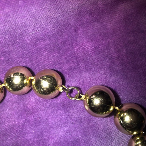 Necklace with gold-colored beads used, clasp needs replacement
