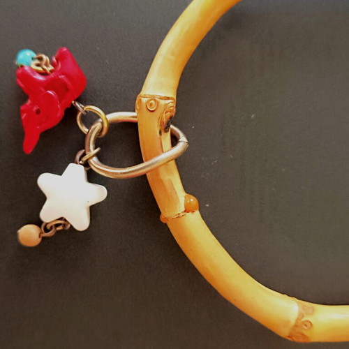 Bamboo bangle with tiki charms like new