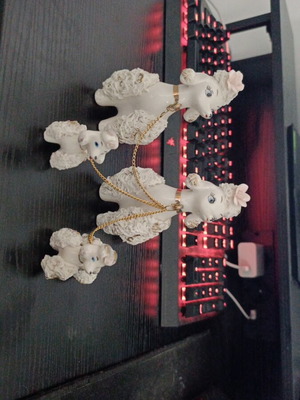 Porcelain poodle figures like new, mother, father and puppies