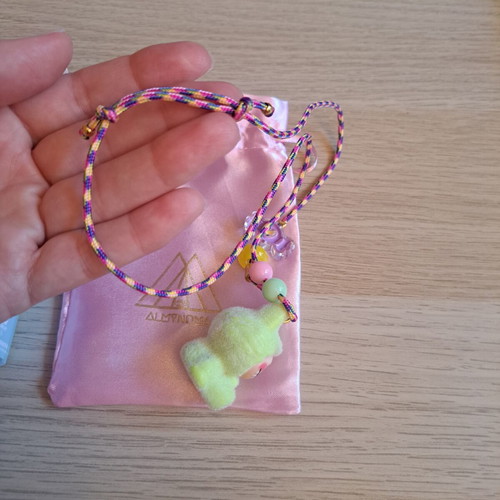 Labunoma necklace with colorful fuzzy smiling monster charm, like new