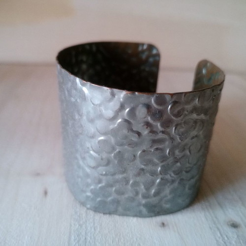 Metal bracelet used with hammered design, dark silver color