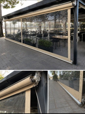 Vertical transparent PVC awnings used with mechanism for cafes and restaurants