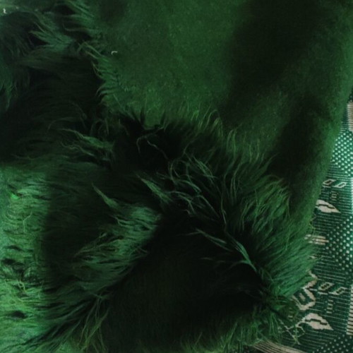 Wool flokati rug like new, dark green with discoloration