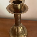 Handmade antique candlestick over 100 years old, brass with hammered details, used