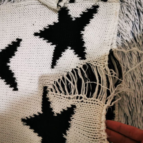 White sweater with black stars like new